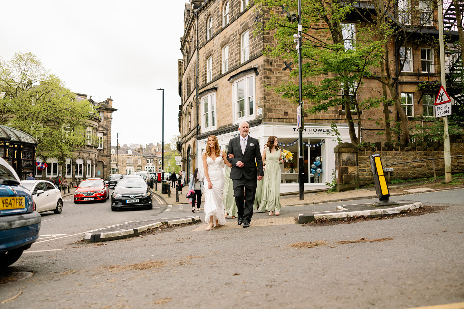 A bride walking through Harrogate in North Yorkshire heading to her wedding ceremony