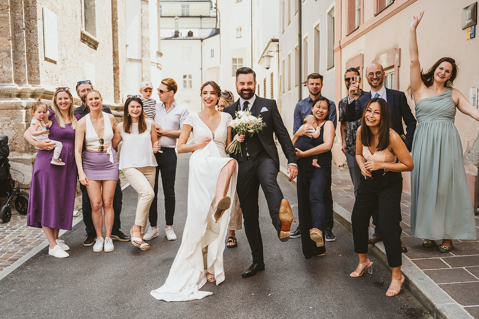 Group picture of wedding guests in the old town in city of Innsbruck in the Tyrol