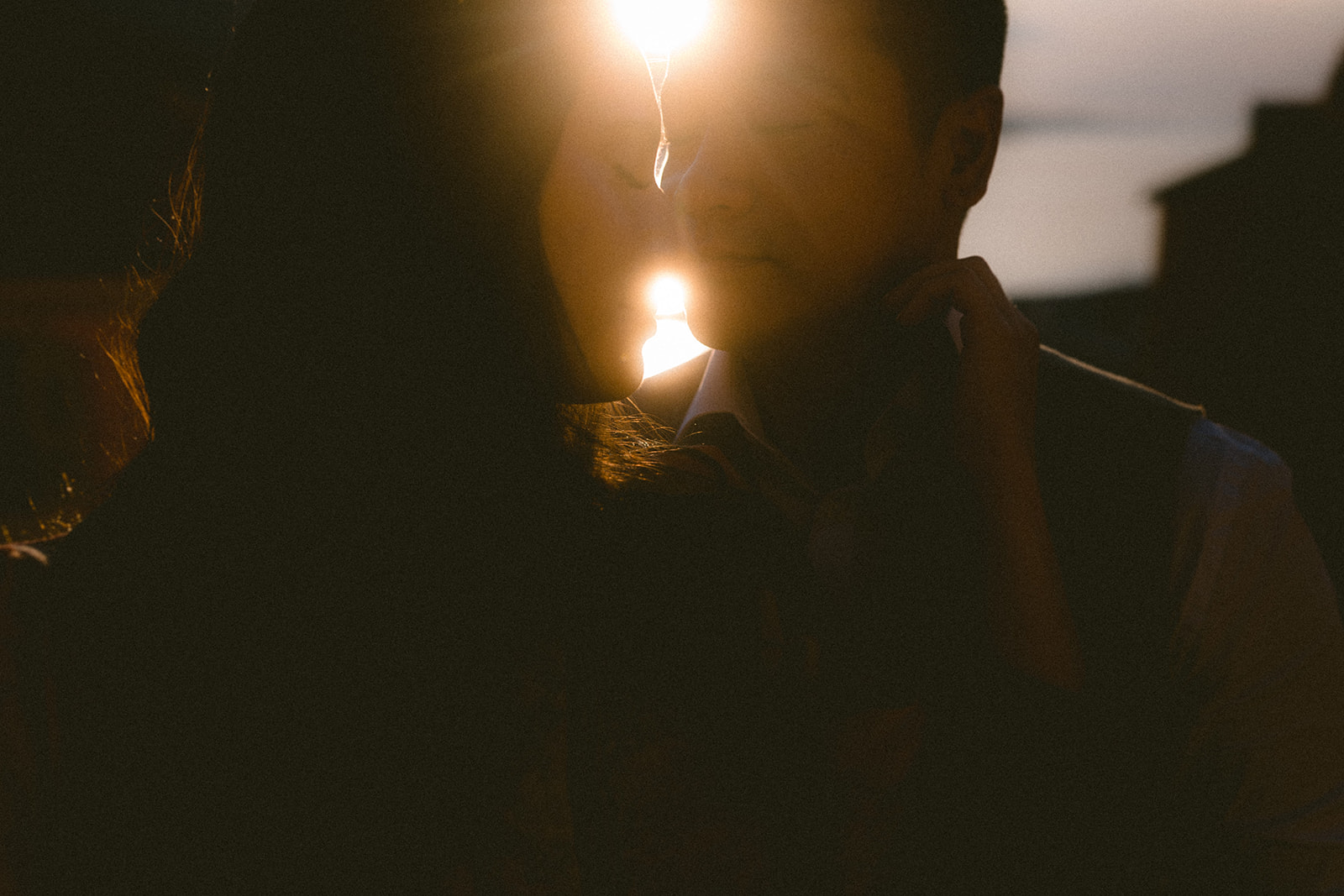 a romantic photo of a couple at sunset