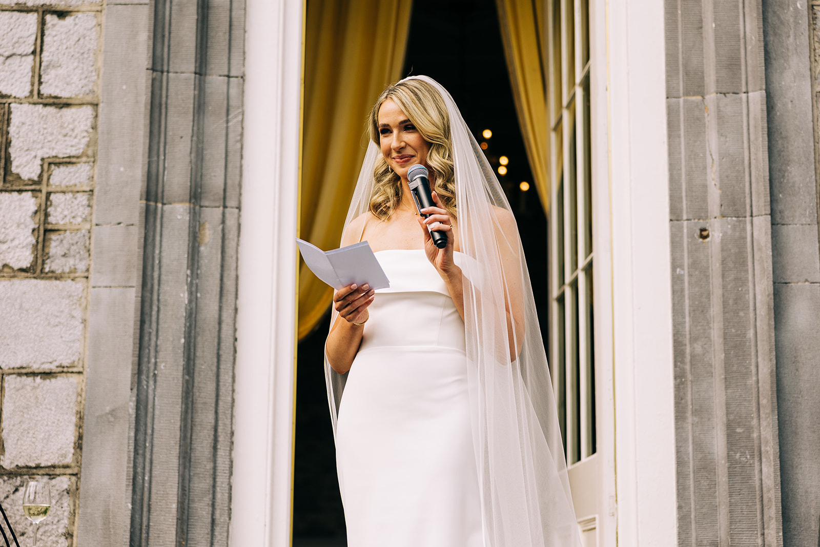 orlaith delivering her bride's speech standing at the doorway to Castle durrow