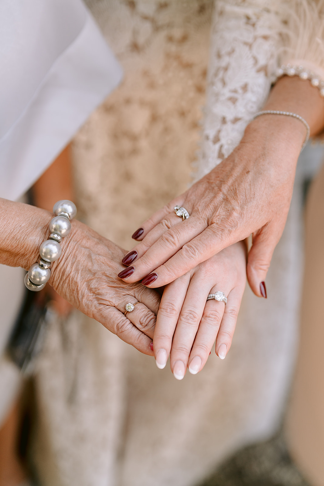 3 generations rings hands closeup bride mother and grandmother