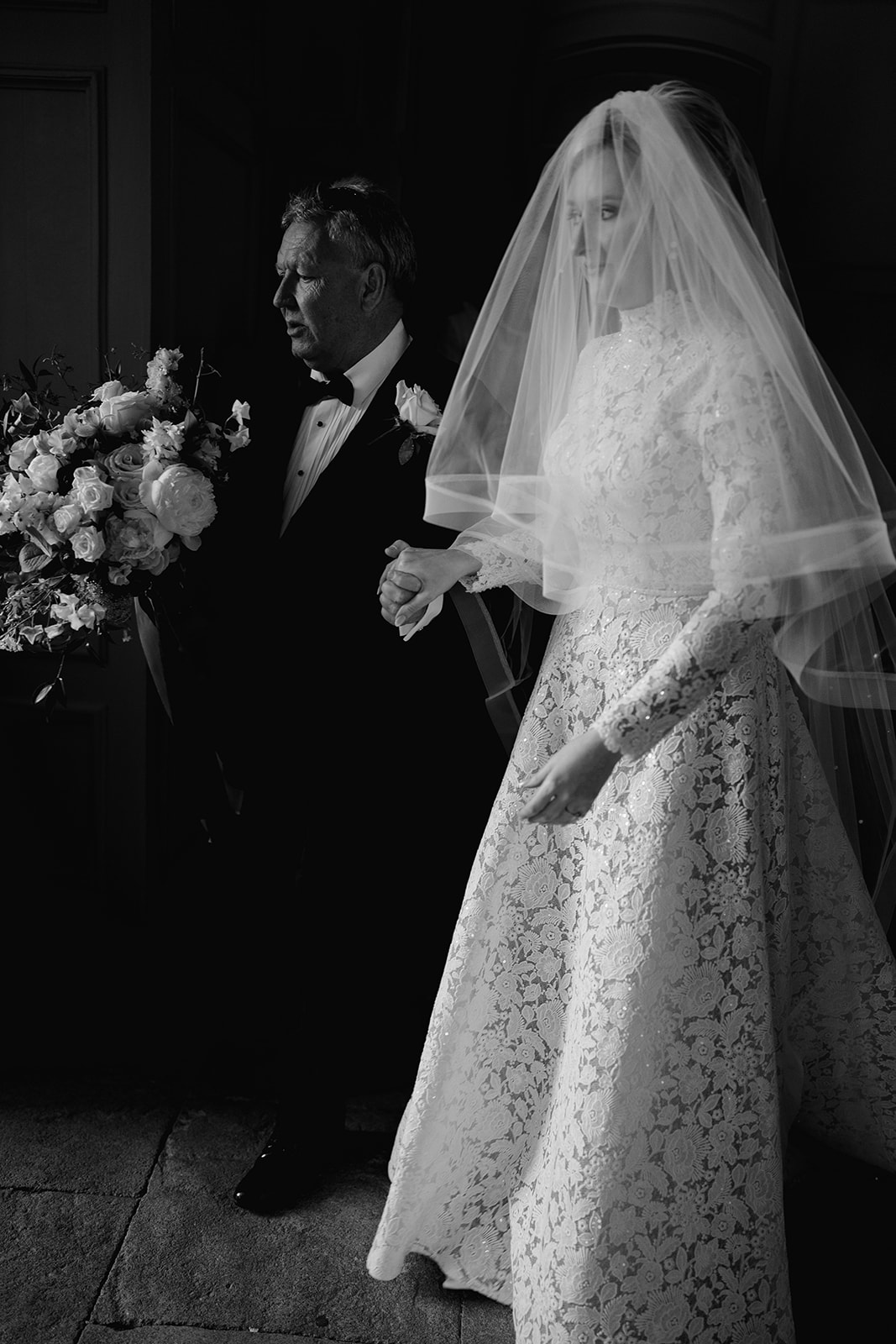 black and white photo of bride and father at brympton house