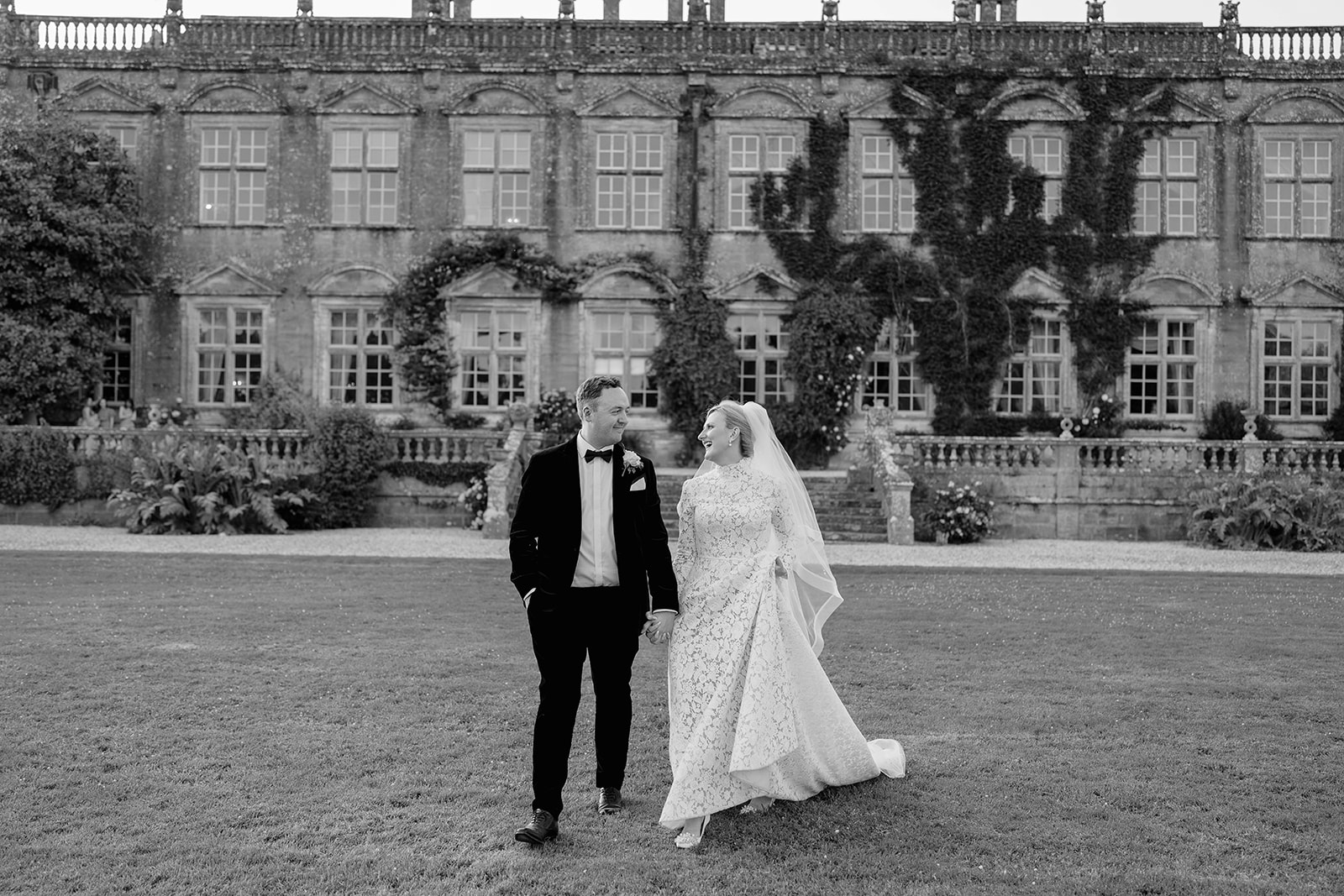 bride and groom with brympton house backgroun