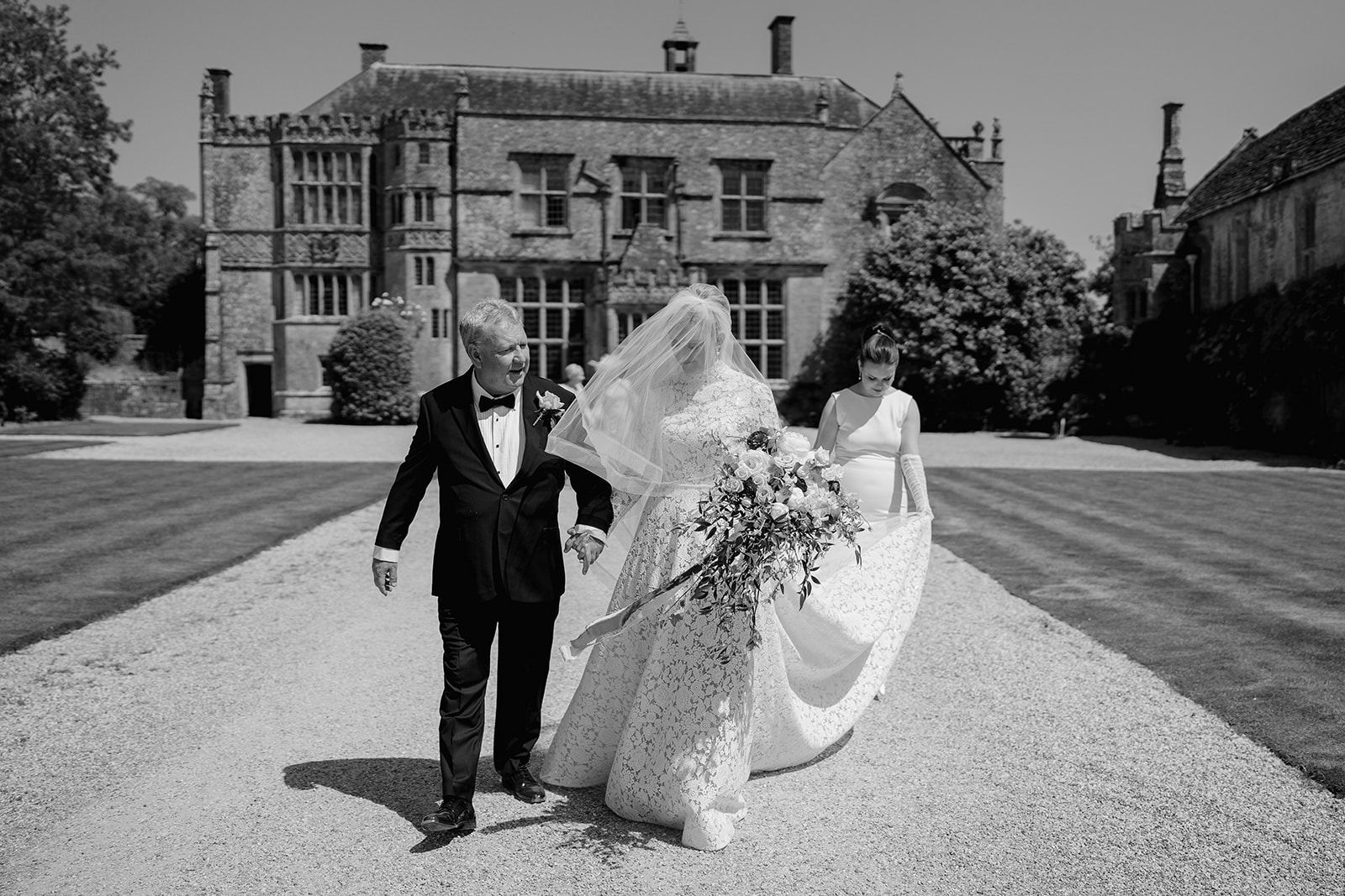 bride and her father walking to the ceremony at st andrews church brympton house