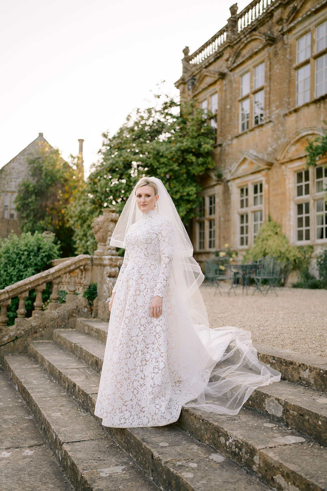 bride on the stairs at brympton house terrace