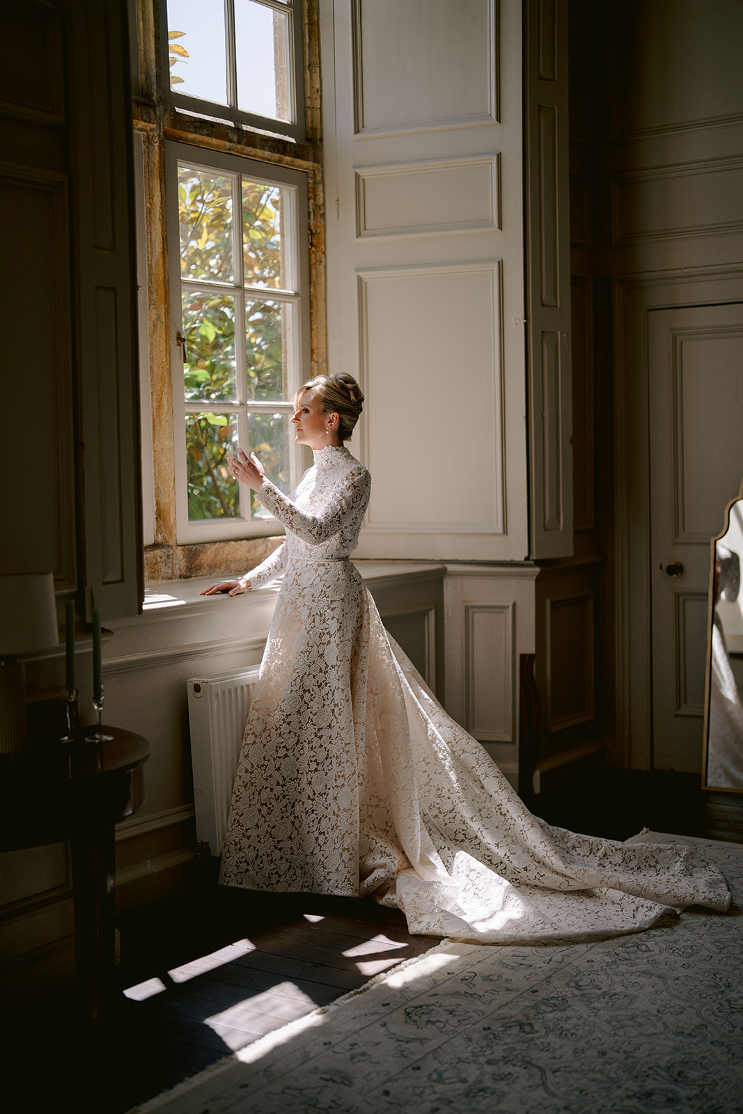  bride in the bridal suite at brympton house in editorial style wedding photo
