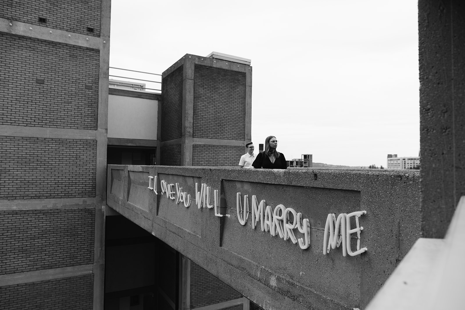 Couple on the I love you will U marry me bridge where he proposed