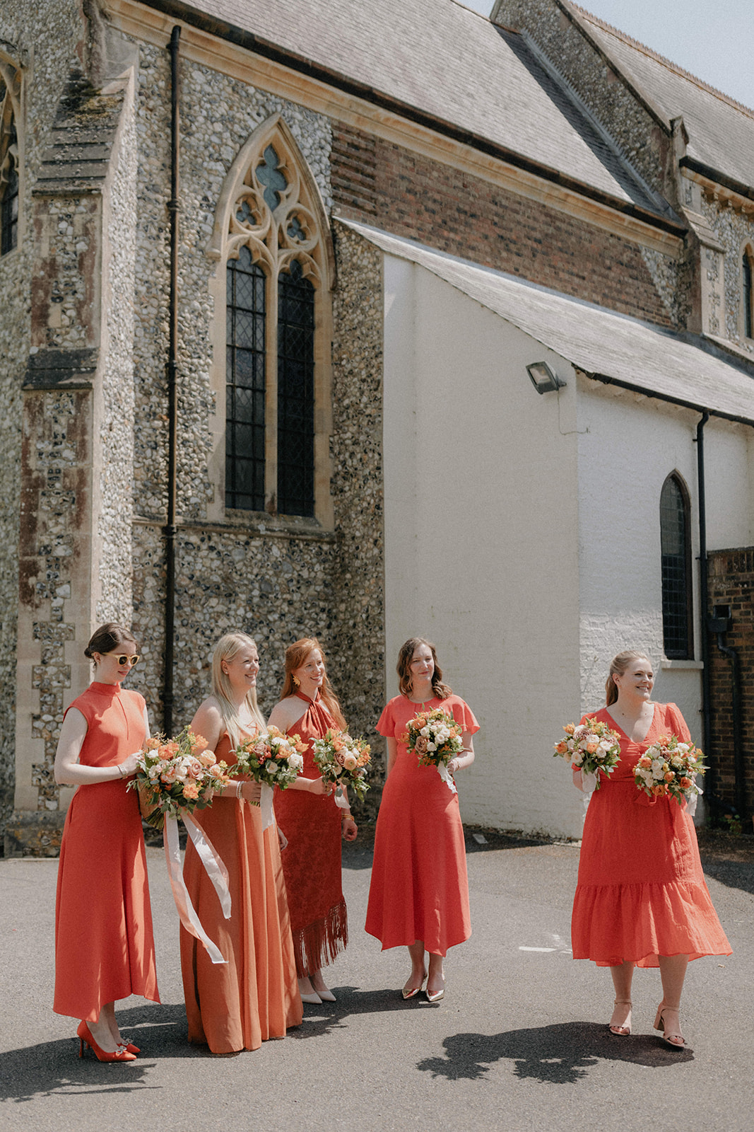 bridesmaids in burnt orange dresses