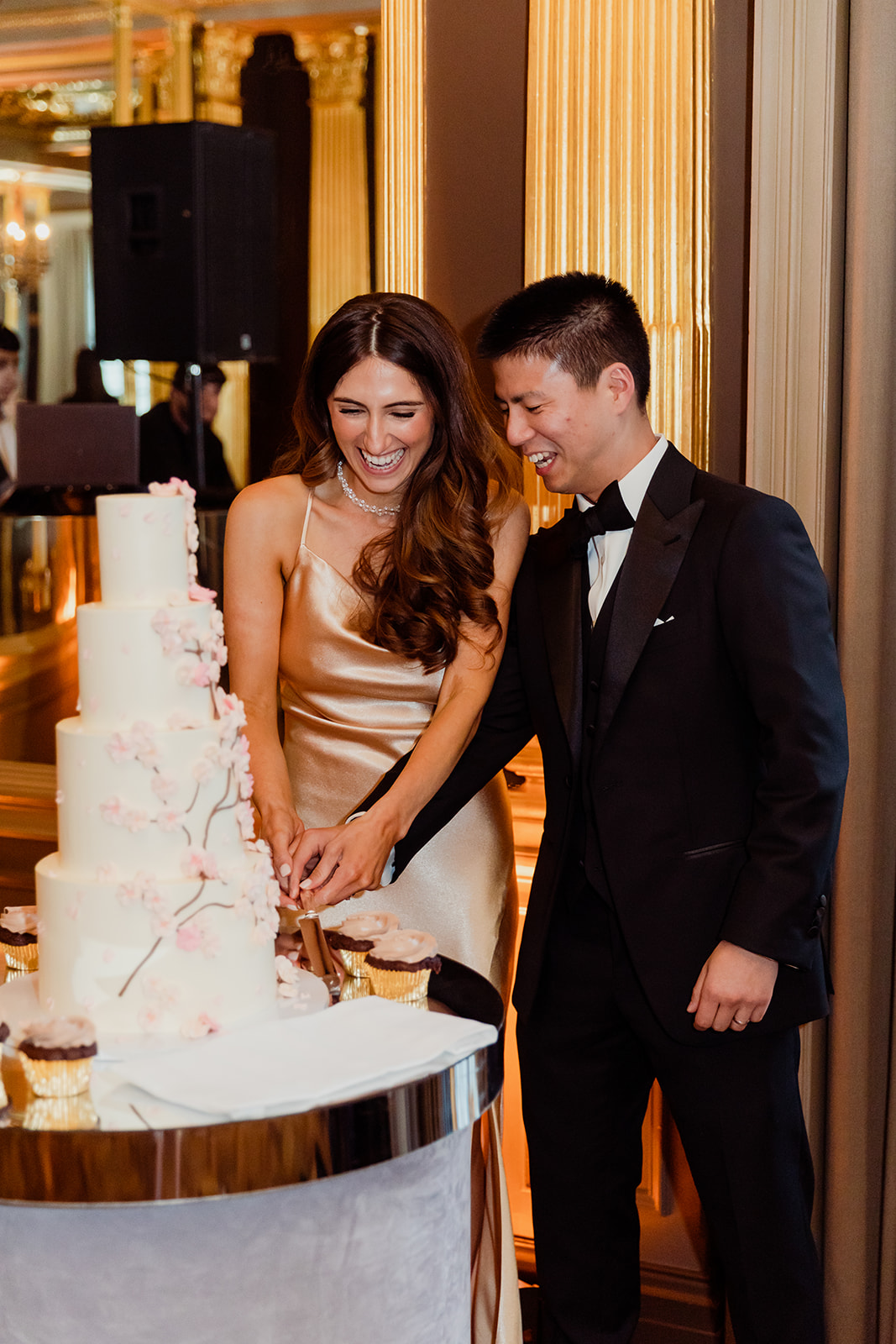couple cutting the wedding cake at the wedding reception at Cafe Royal Hotel in London