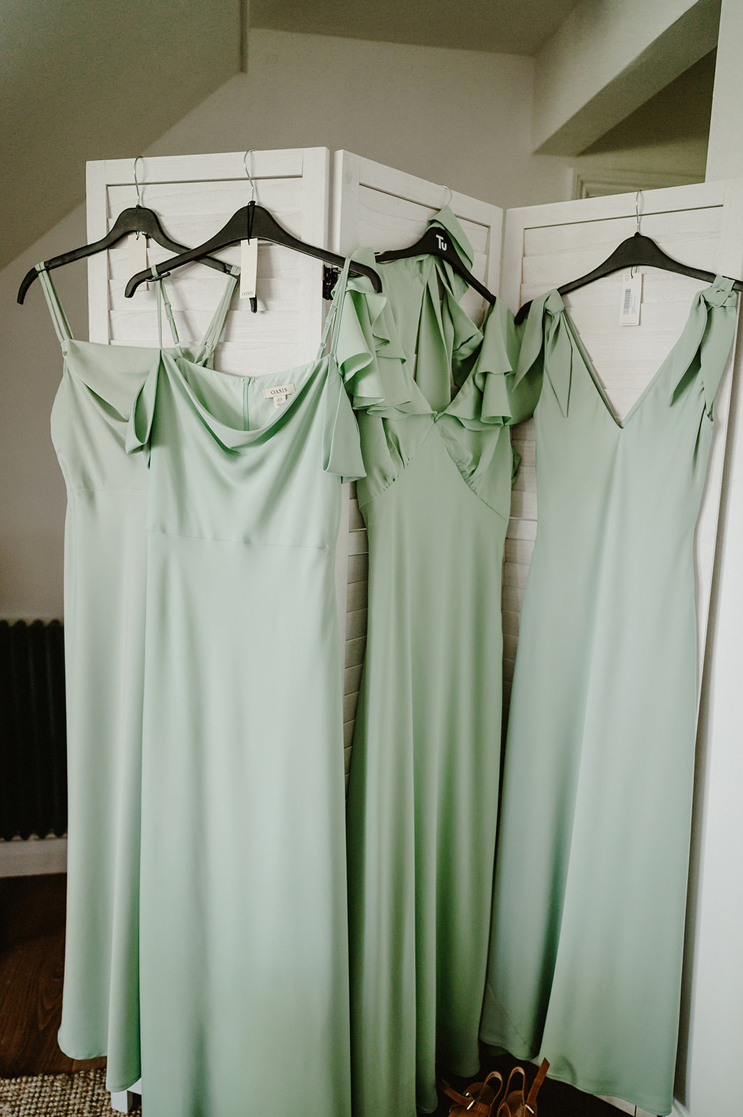 bridesmaids dresses hanging up the morning of the wedding