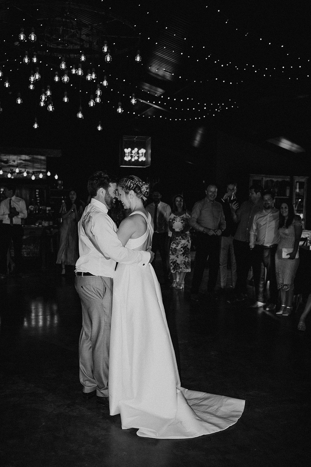 Black and white portrait photo of the first dance at a summer wedding at Silchester Farm