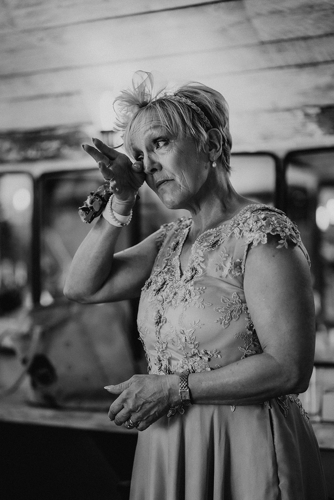 Bride's mum wipes away a tear at a summer wedding at Silchester Farm