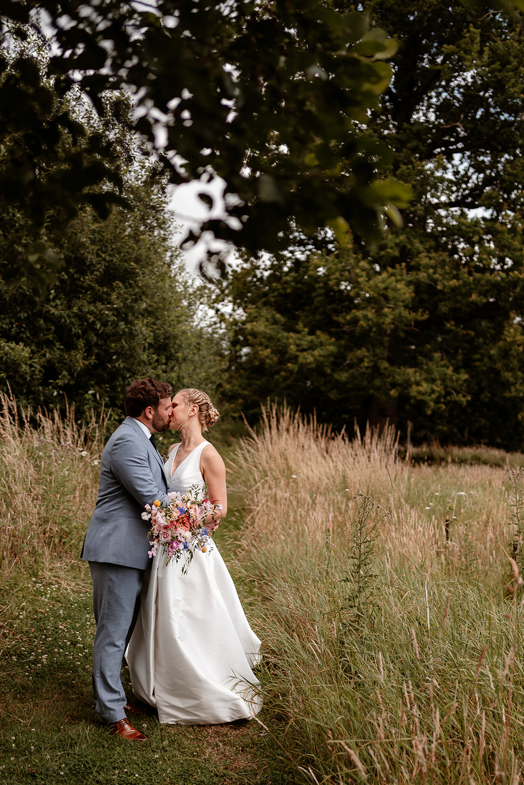 Editorial photograph of the bride and groom together in the gardens at a summer wedding at Silchester Farm