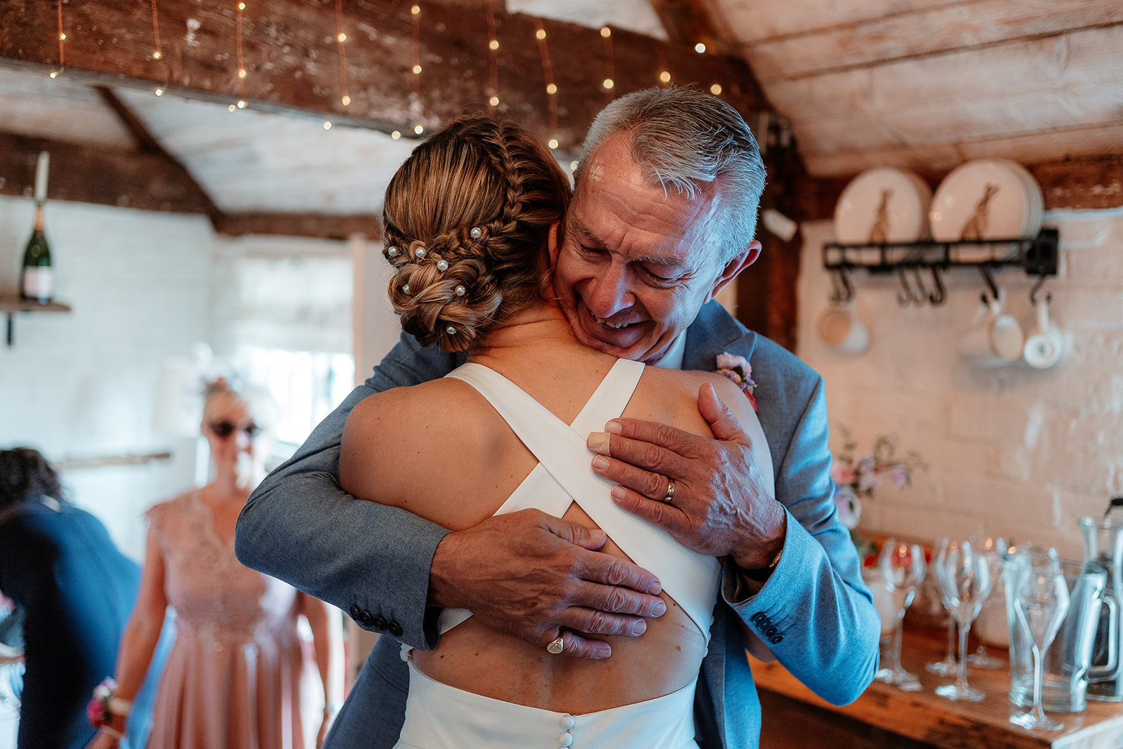 Emotional first look with a bride and her dad at a summer wedding at Silchester Farm
