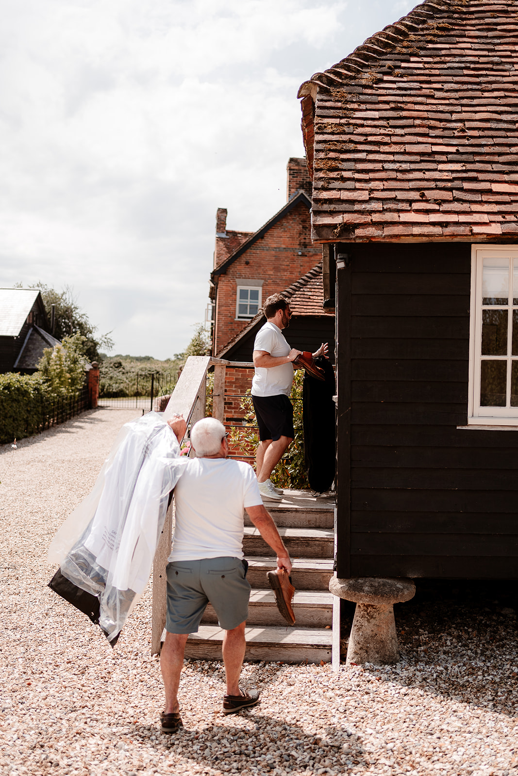 Groom and his Dad getting ready at a summer wedding at Silchester Farm