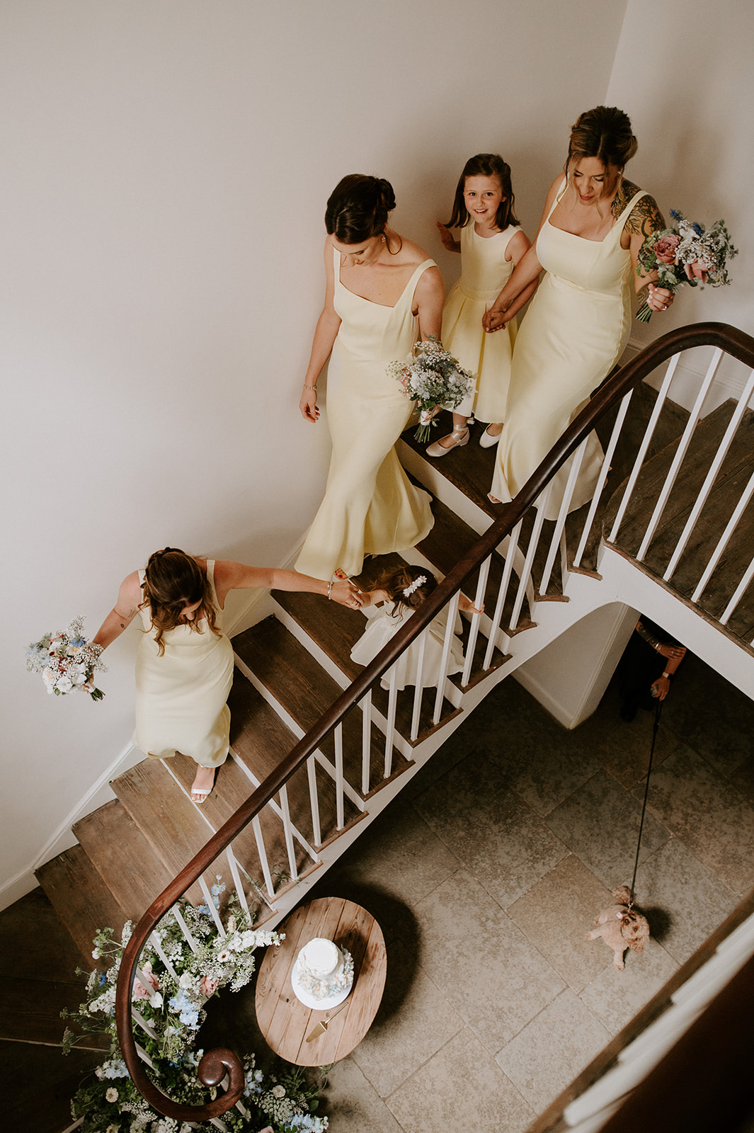 bridesmaids walking downstairs at aswarby rectory