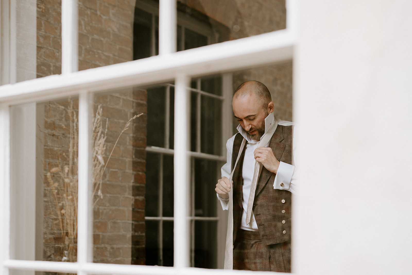 groom getting ready at aswarby rectory