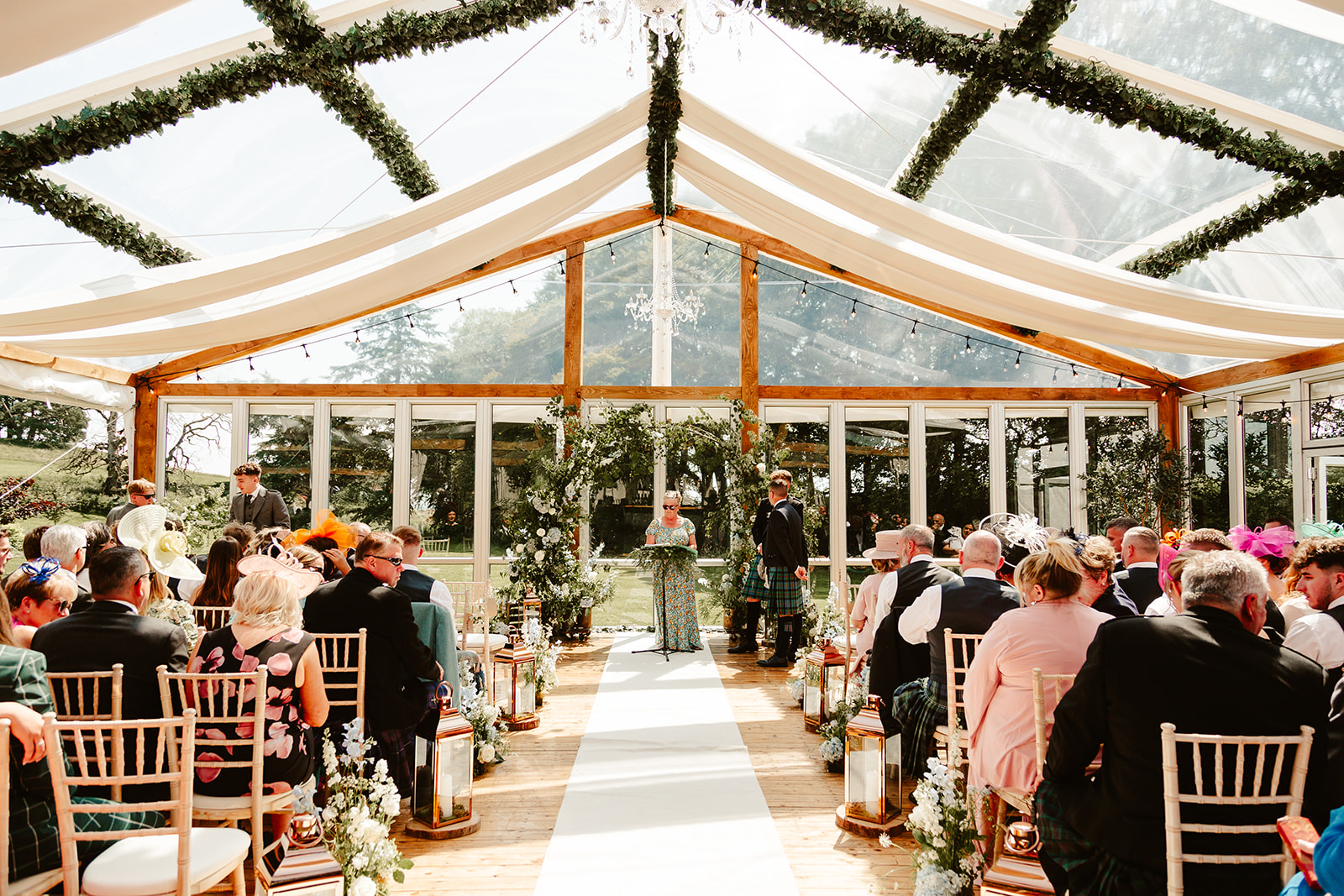 Wedding ceremony at Elrick House Wedding Venue - filled with rustic greenery