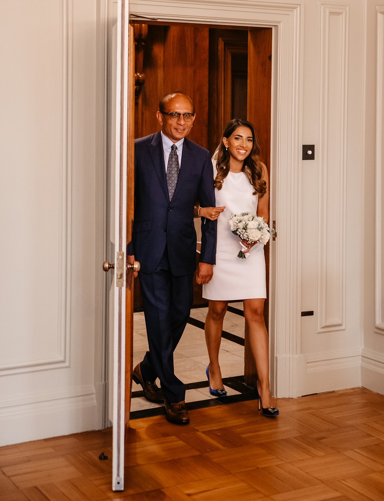 Bride and father entering the wedding Ceremony at Old Marylebone Town Hall in London