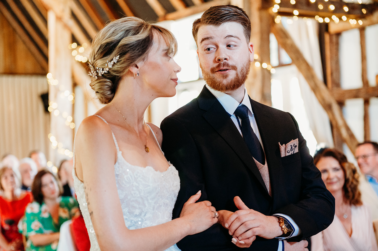 Bride and groom exchanging vows at Clock Barn