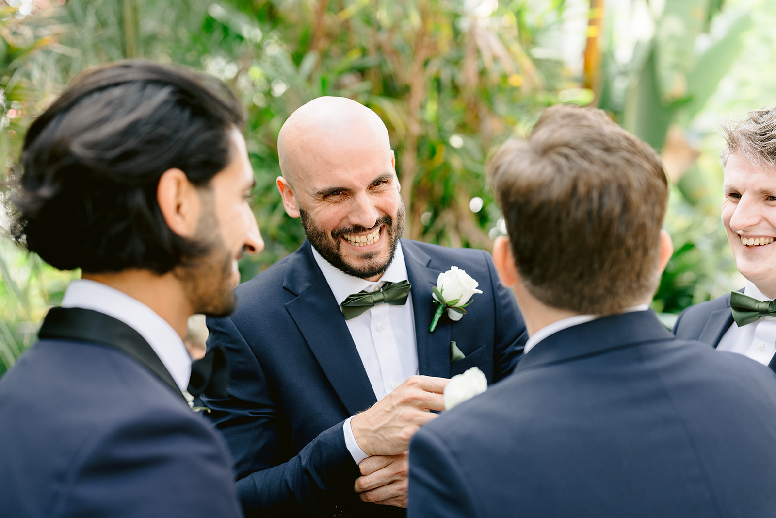 groom and best man joking before ceremony