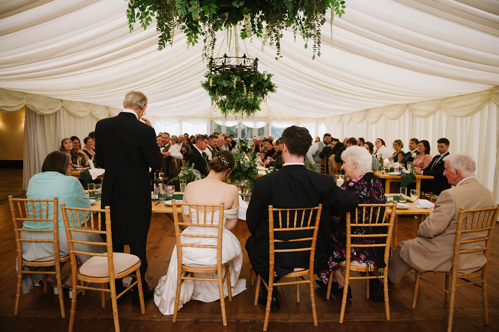 The father of the bride speech in the marquee from behind the top table so you can see the guests listening