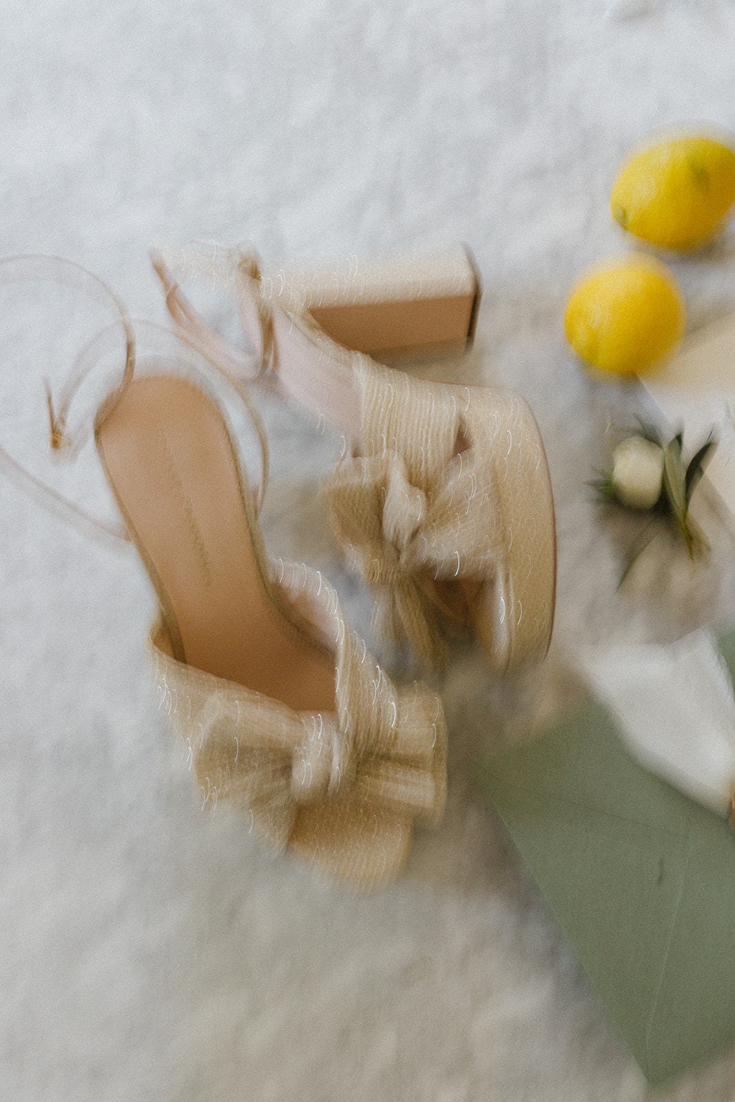 Elegant-Bridal-Shoes-with-Citrus-and-Olives-on-Marble-Table
