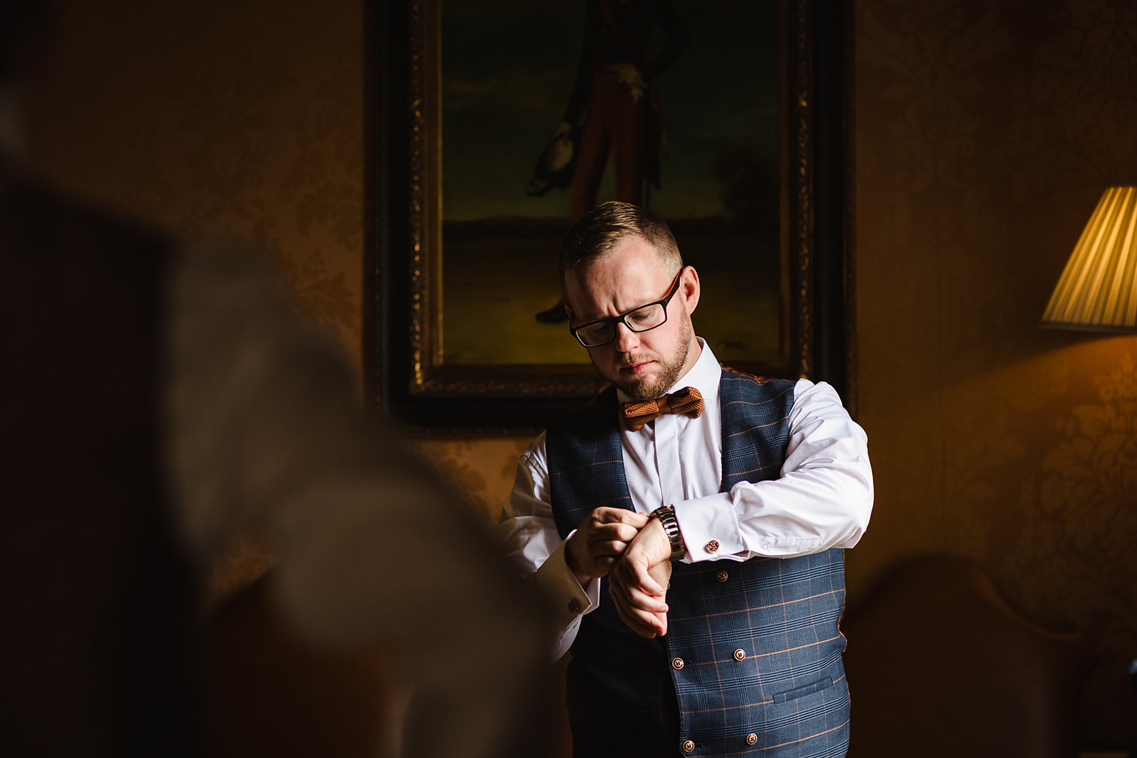 groom checking his watch at stapleford park