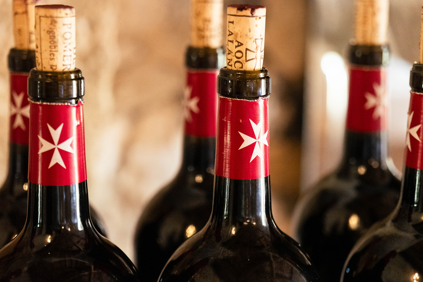 the distinctive tops of Pomerol red wine at a wedding in france