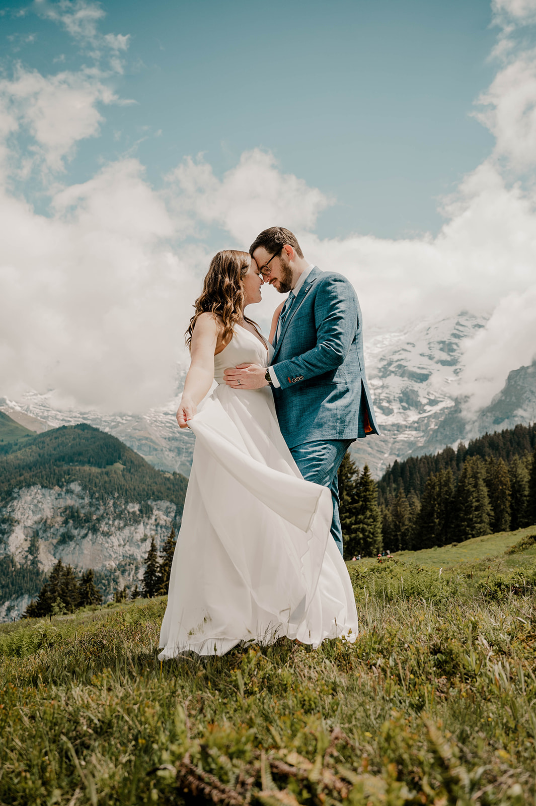 A couple shares a quiet moment after celebrating their love in an intimate ceremony above Lauterbrunnen