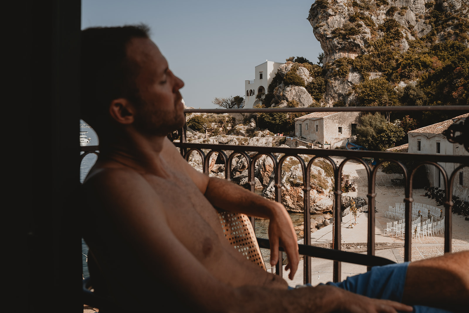 Boy relaxing on the balcony in the Tonnara di Scopello