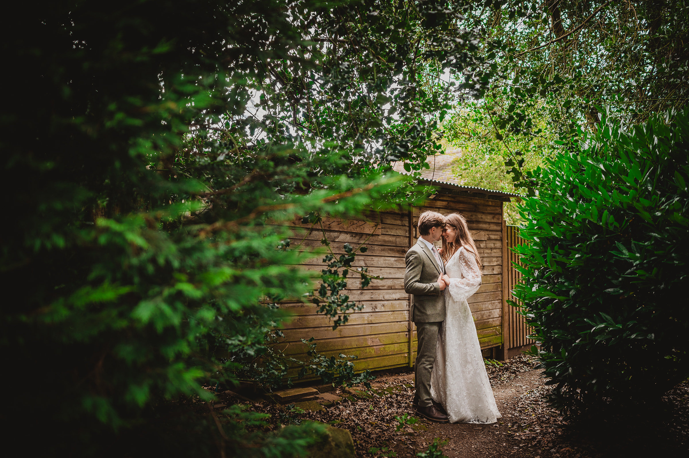 A couple share a moment at Barns at Redcoats wedding venue