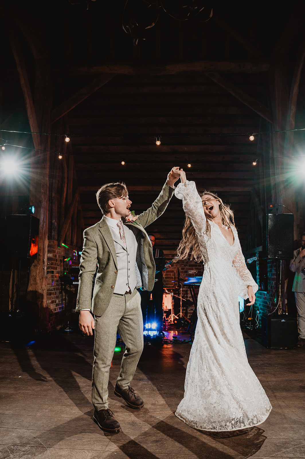 A couple share their first dance at Barns at Redcoats