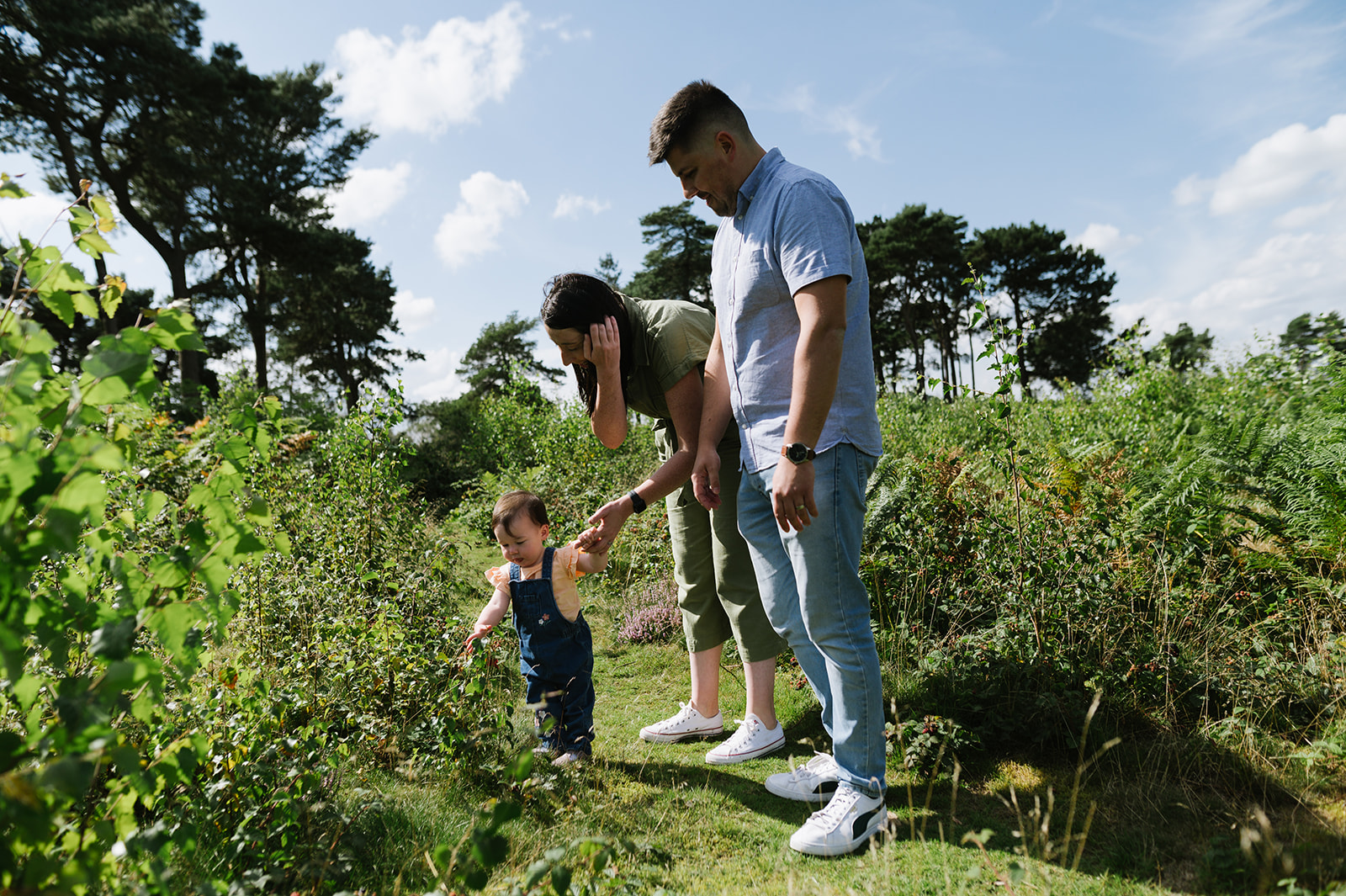 One year old girl relaxed photos with her parents in the Lickey Hills Birmingham