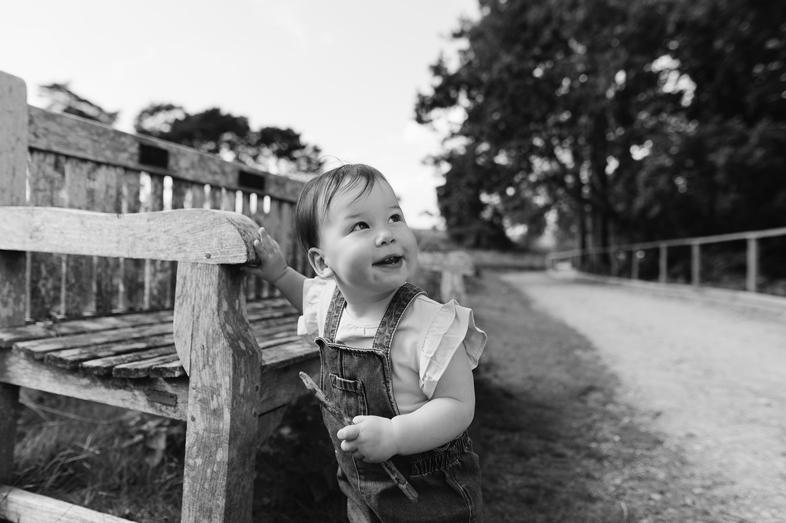 One year old girl relaxed photos with her parents in the Lickey Hills Birmingham
