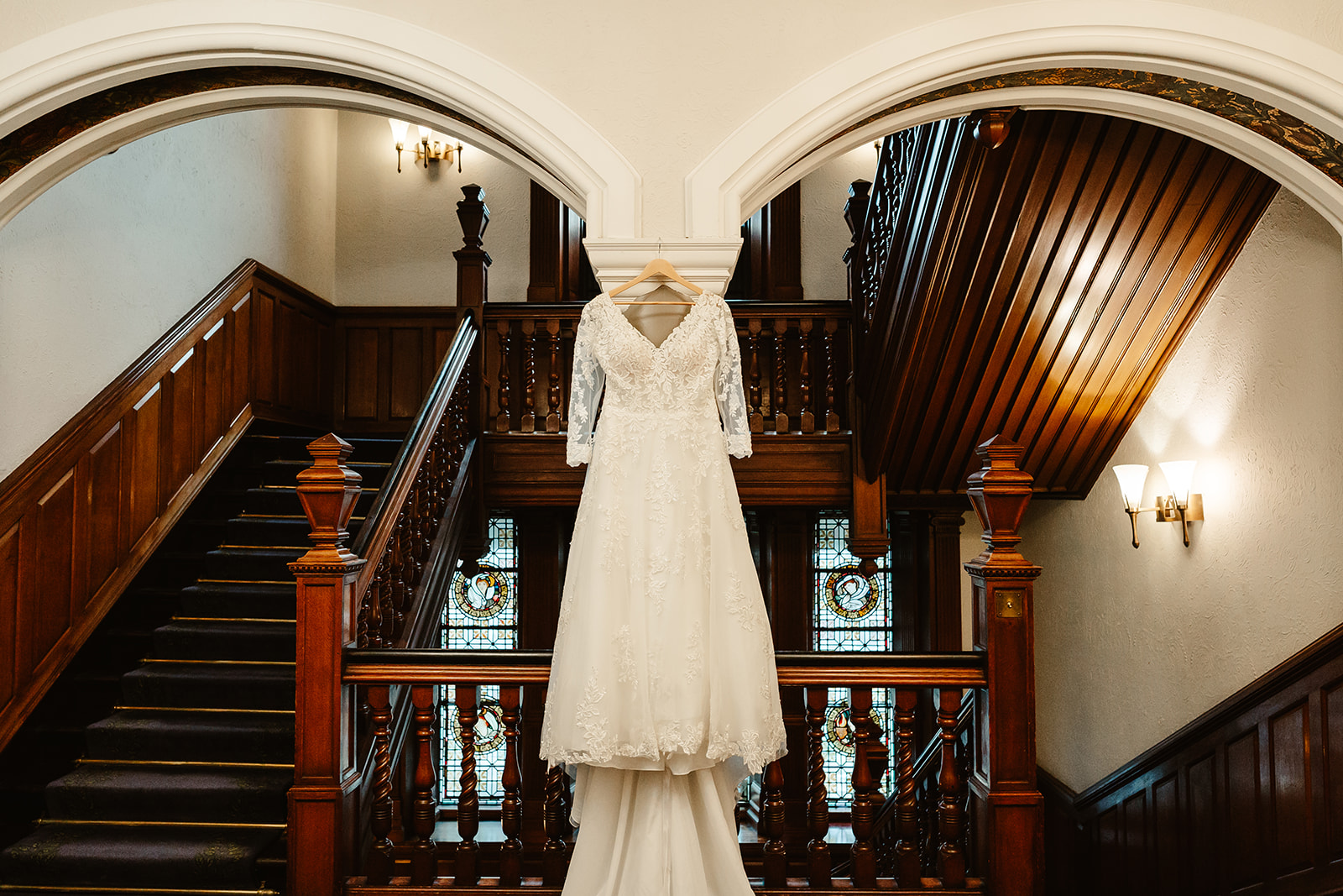 Image of a brides dress having up between two arches at Ardoe House Hotel