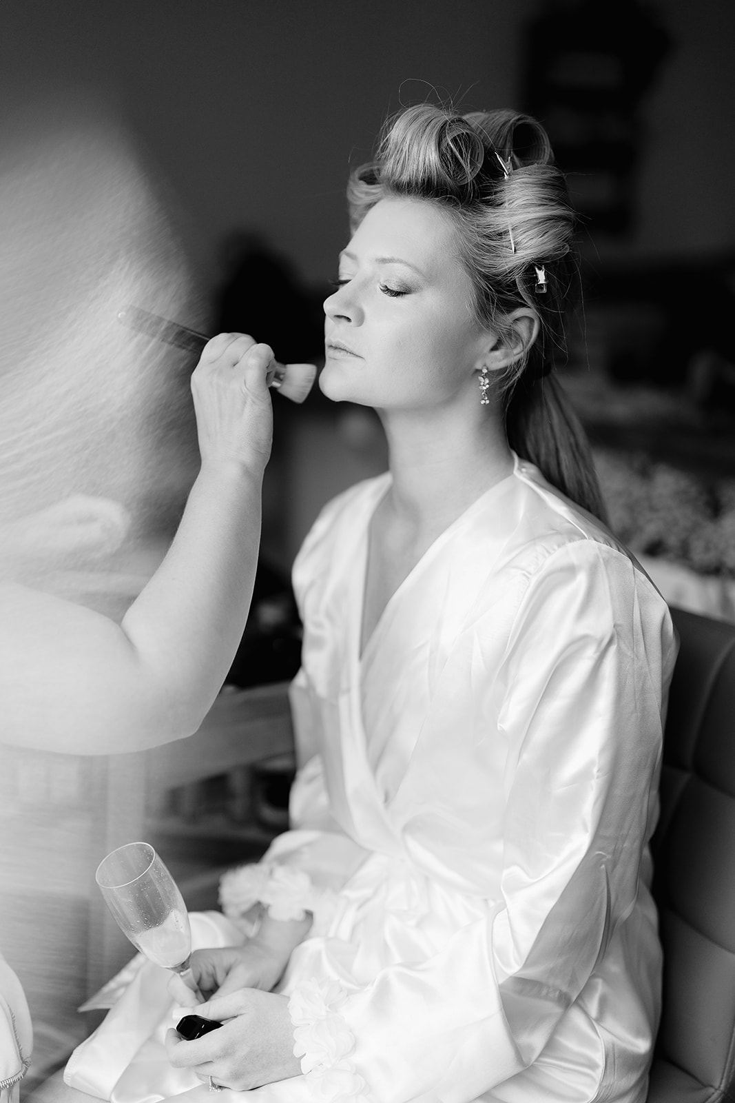 bride having her makeup done by artist
