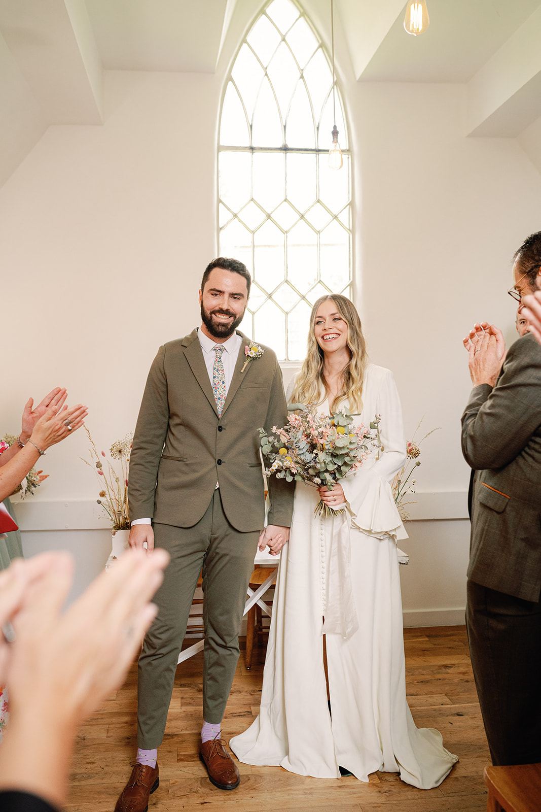 Couples family applaud after their small wedding ceremony