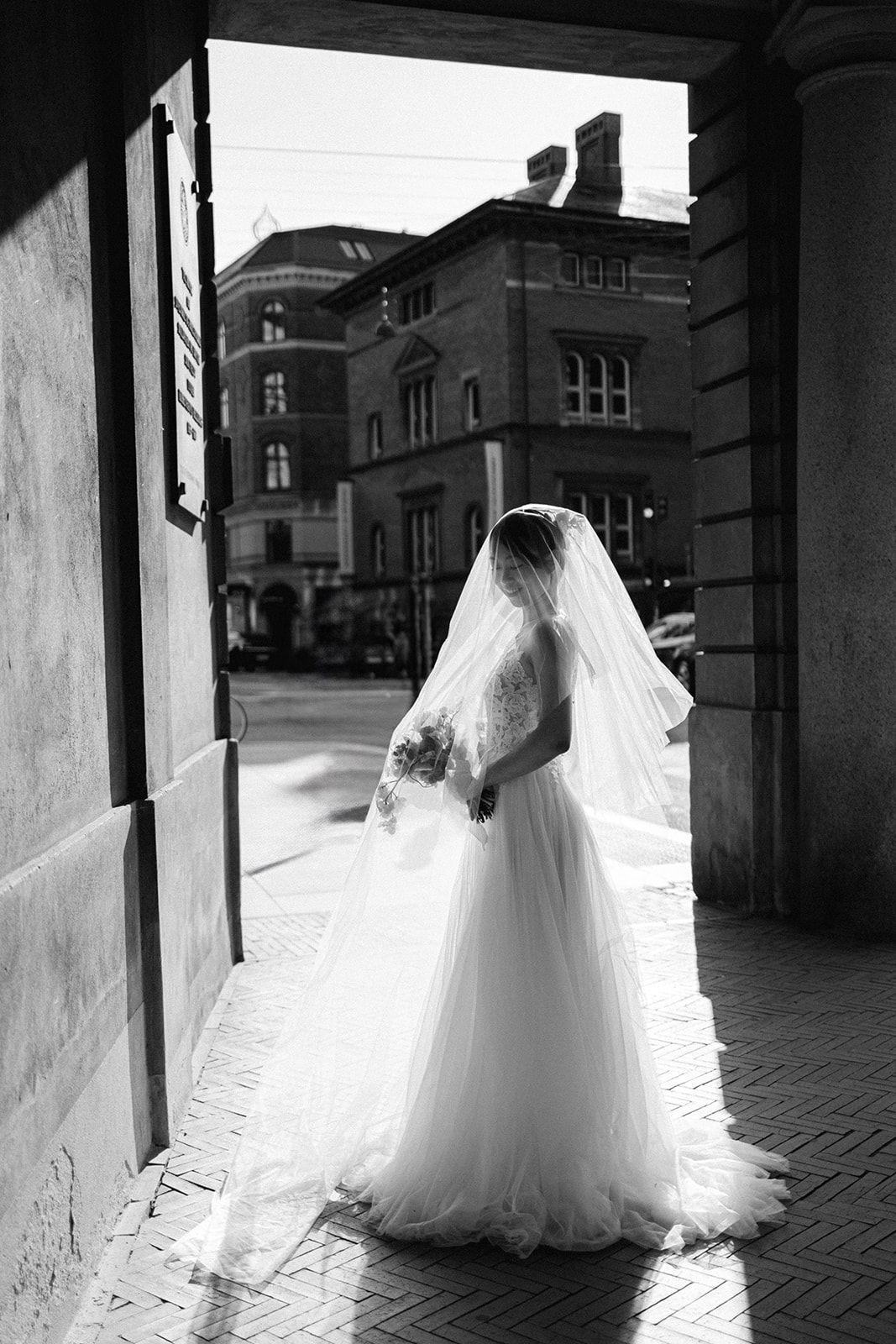 Copenhagen city hall wedding bridal portrait fine art kissing on the street