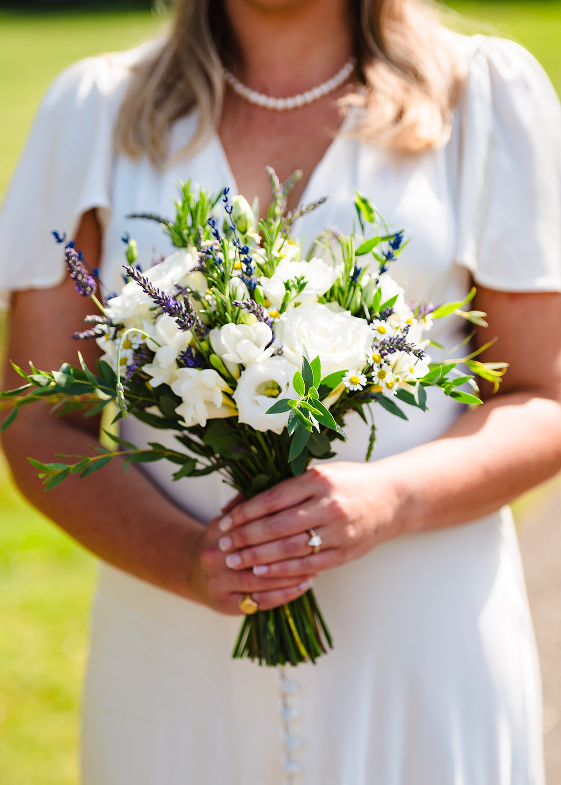 Close up of bride holding her wedding bouquet