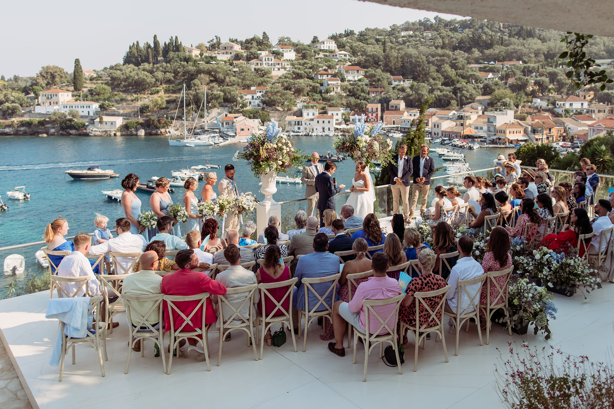 A couple eloped in Paxos, Greece overlooking Loggos port.