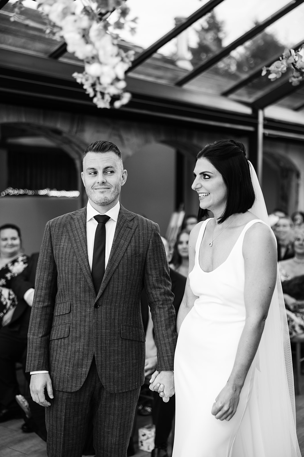 black and white portrait photo of a couple during the ceremony at the hovels