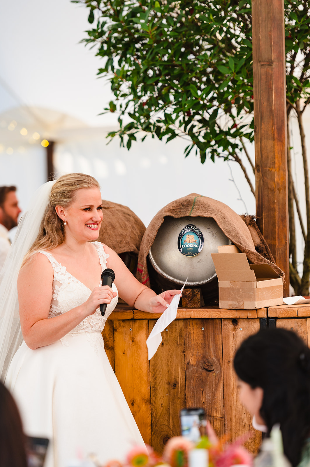 bride giving a speech at her wedding reception at exton park rutland