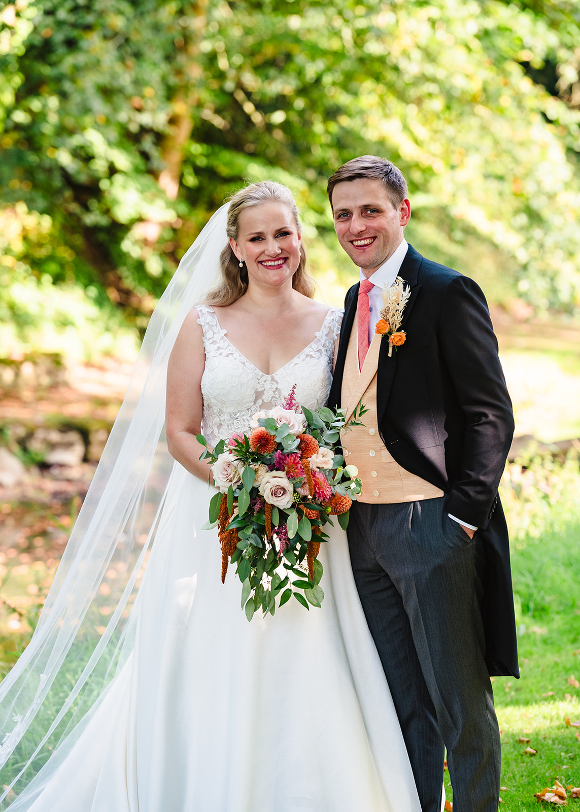 bride and groom looking towards camera captured by Amanda Forman Photography at exton park rutland