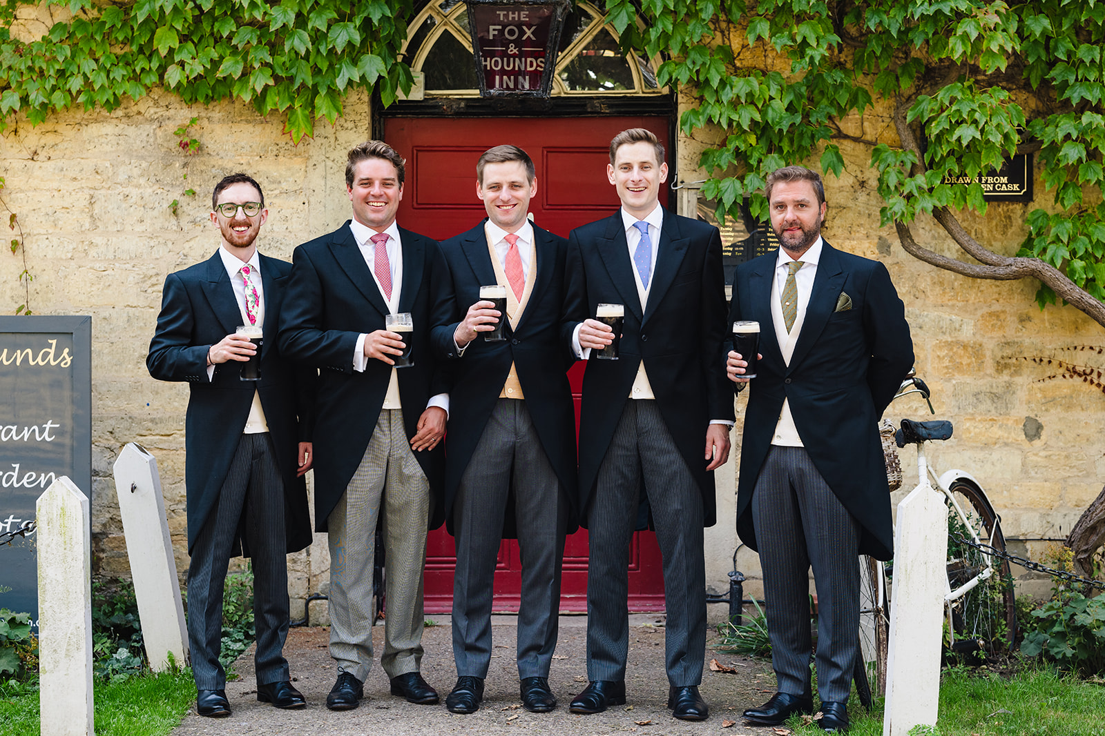 groom and his groomsmen outside the fox and hounds pub in exton