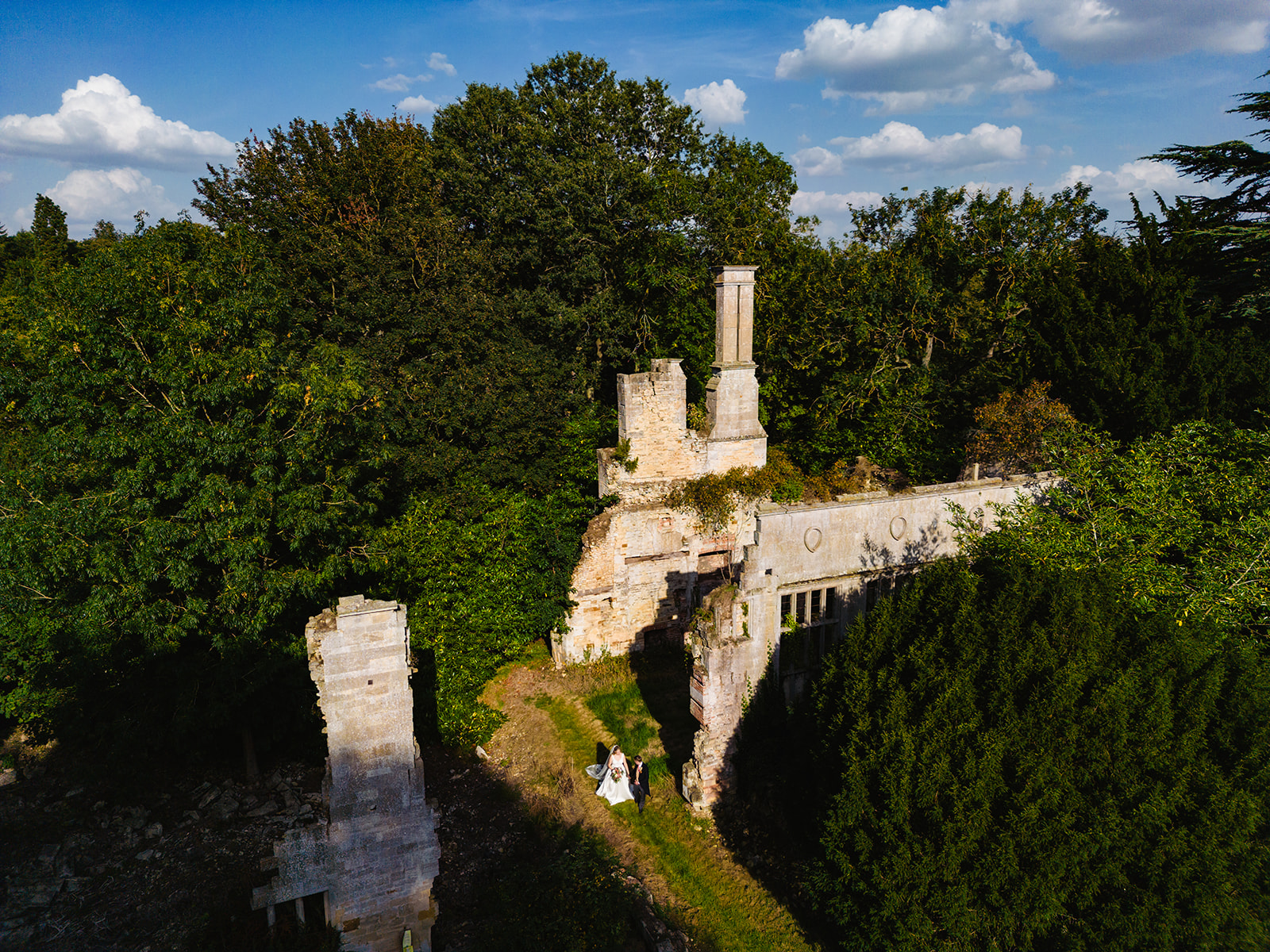 overhead shot of bride and groom in the ruins of exton park rutland