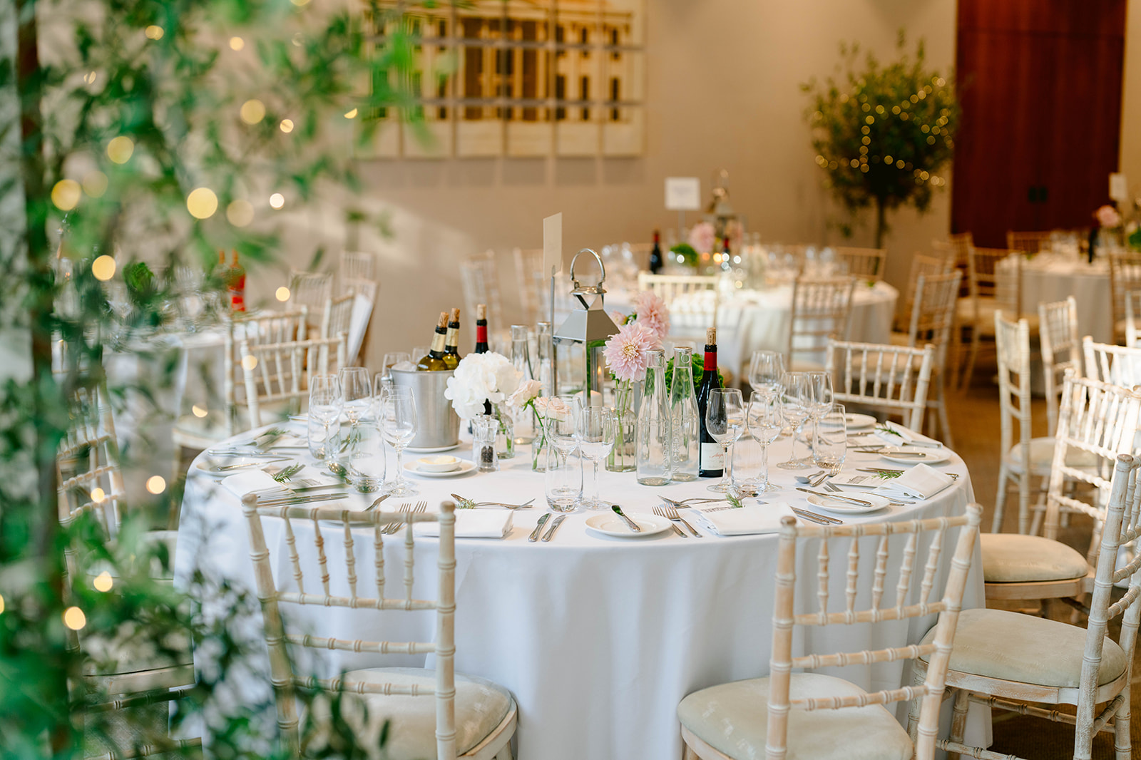 a table decorated for the wedding breakfast in the dining hall of the hurlingham club