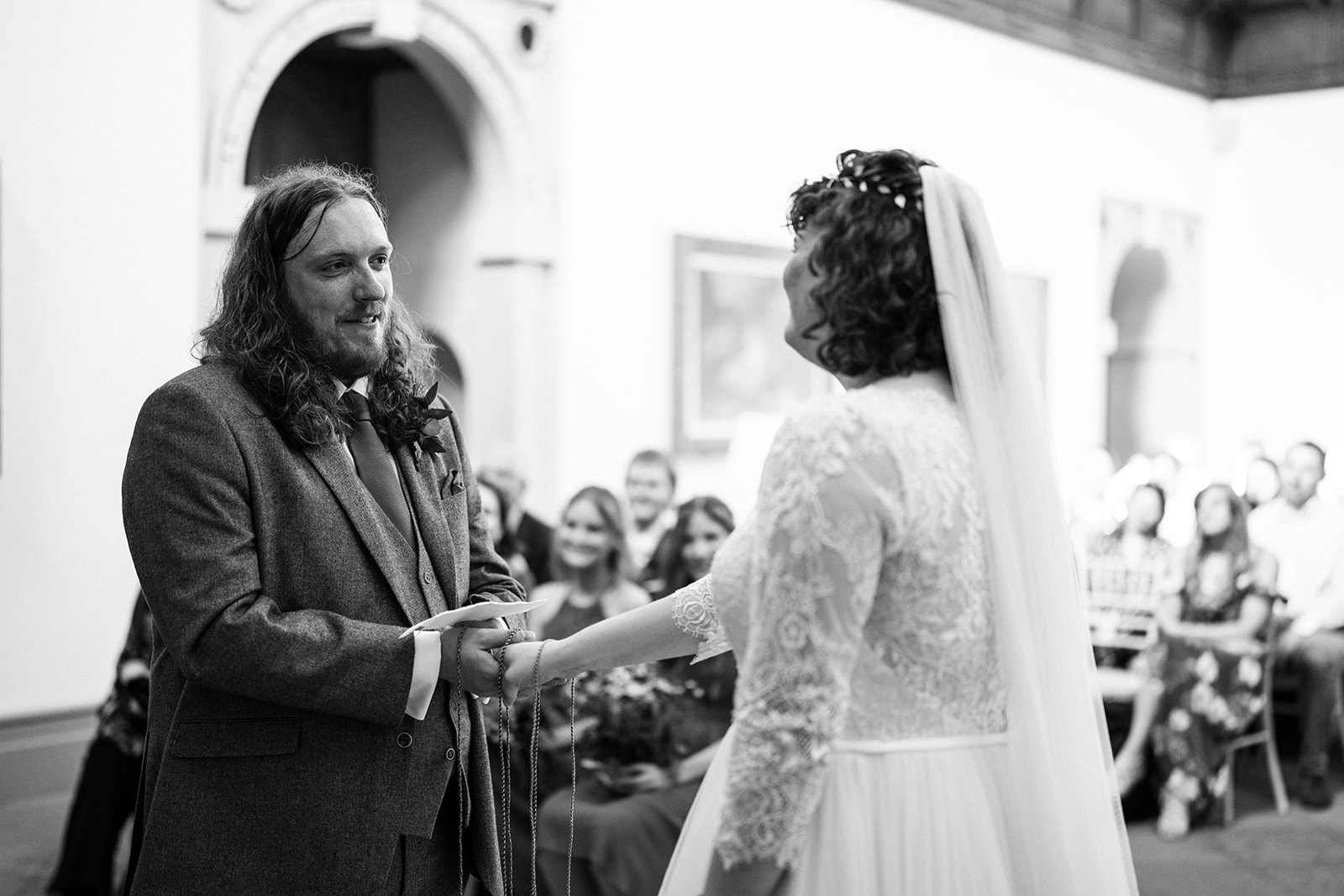 Wollaton Hall Wedding Photography - groom reading his wedding vows