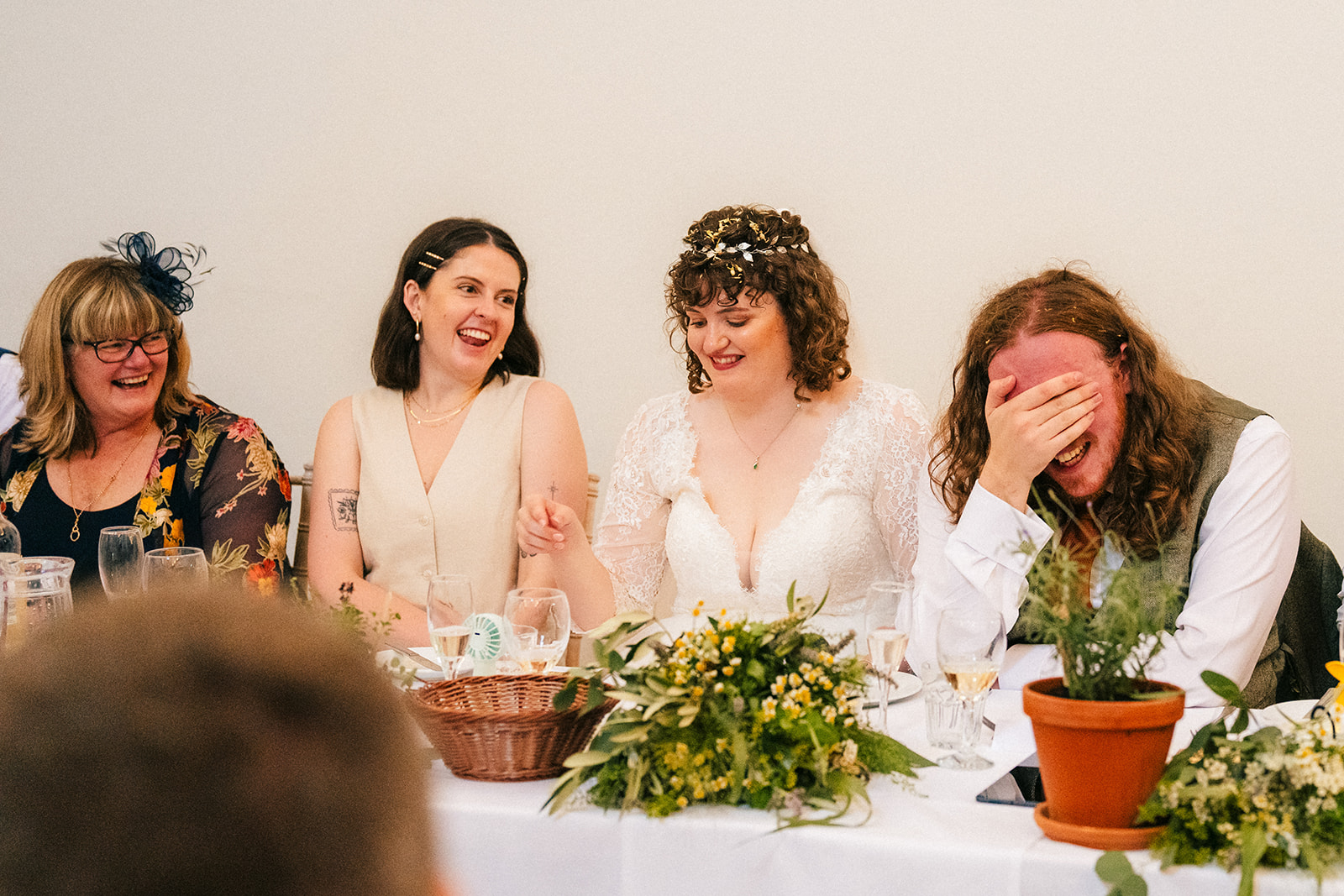 The groom reacts to an embarrassing story during the wedding speeches