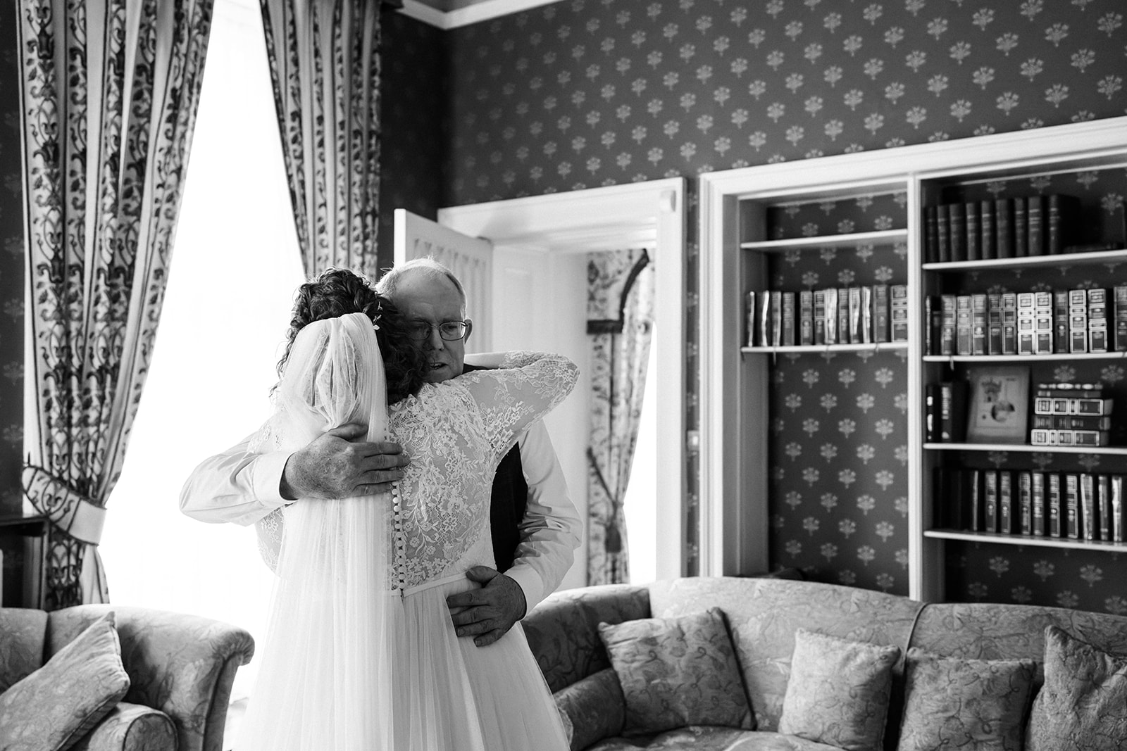 Wollaton Hall Wedding Photography - father of the bride, hugging his daughter on her wedding day